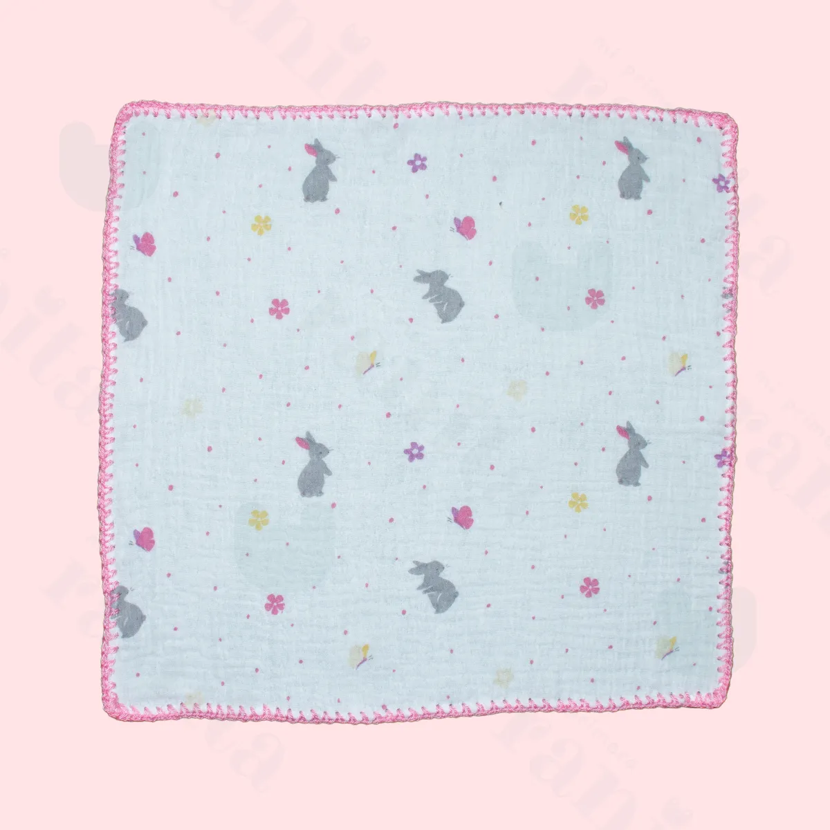 Pink rabbit doll with pink-embroidered muslin