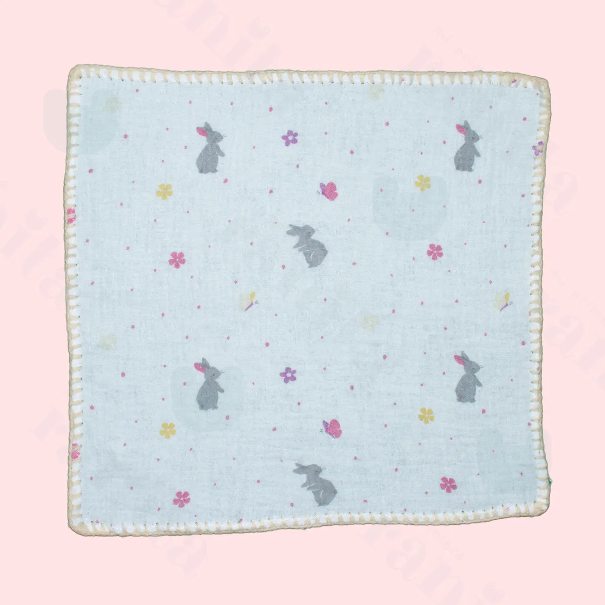 Beige rabbit doll with beige-embroidered muslin